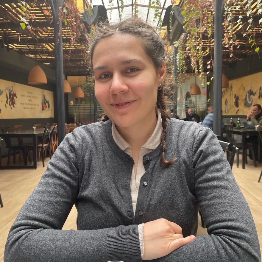 Selay Tekgül seated indoors